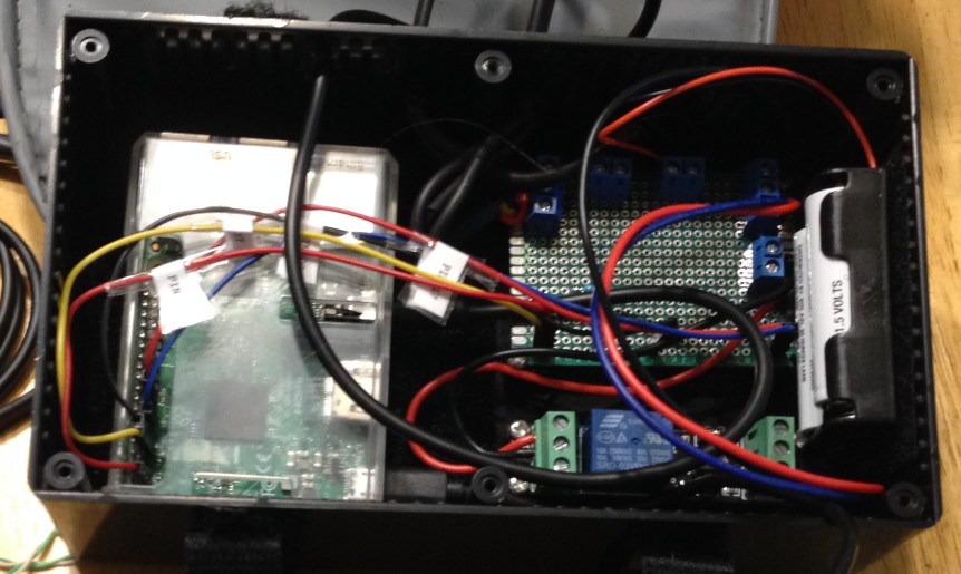 Taco Machine innards: a RaspberryPi, a wiring junction board, and a relay board.